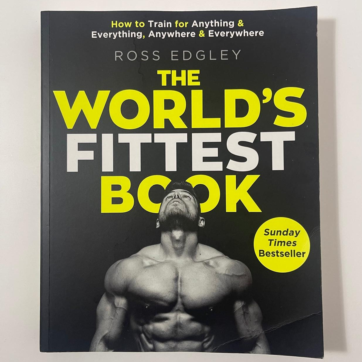 Book titled 'The World's Fittest Book' by Ross Edgley on a white background