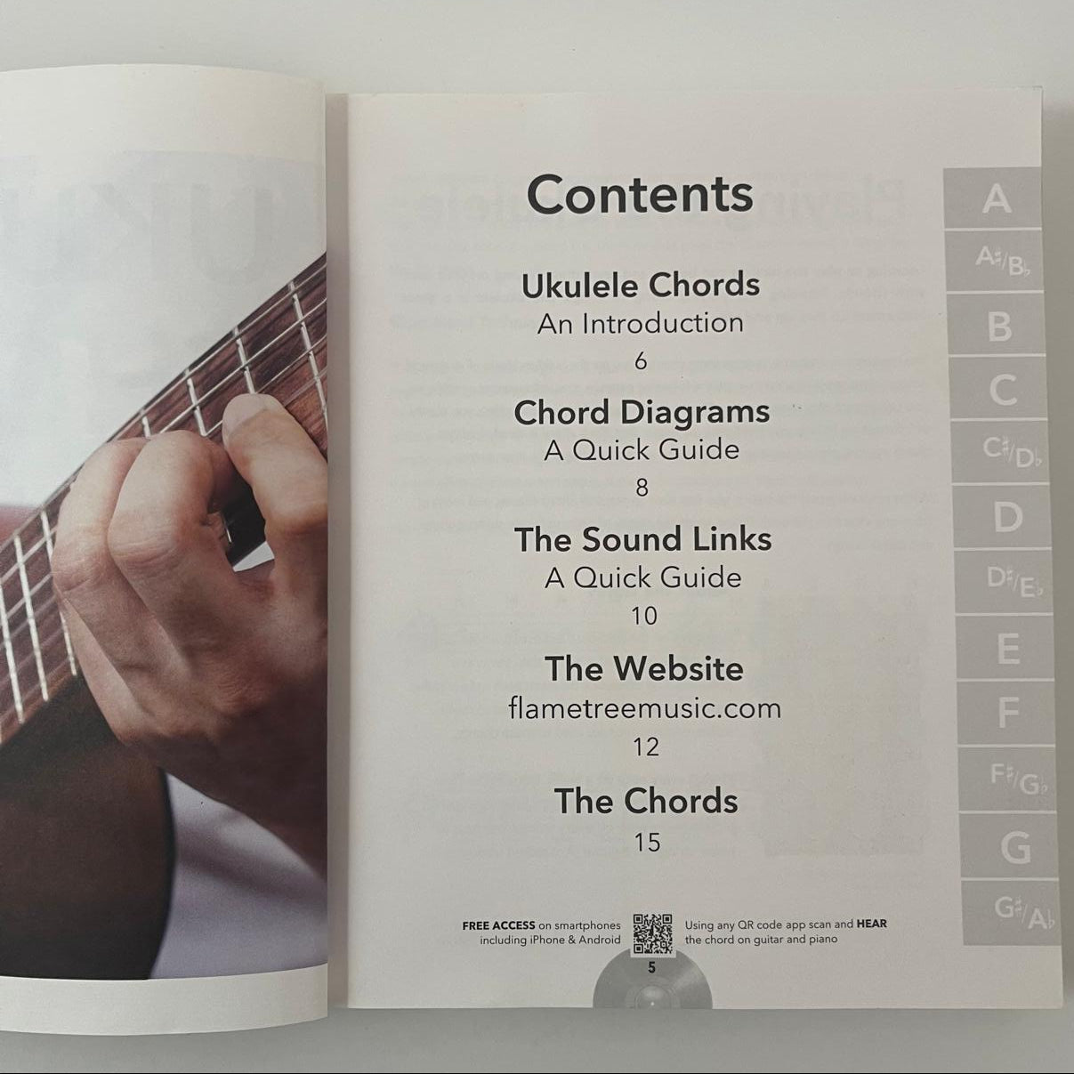 Contents page of a music book with a hand playing guitar and chord diagrams.